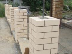 Building a fence made of bricks