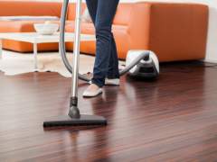 Clean the parquet floor with a vacuum cleaner