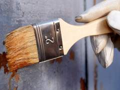 Paint the metal surface with a brush