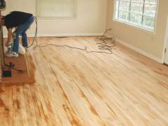 Sanding the floor made of natural wood