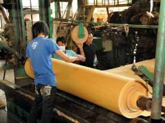 Manufacture of veneer sheets of natural wood